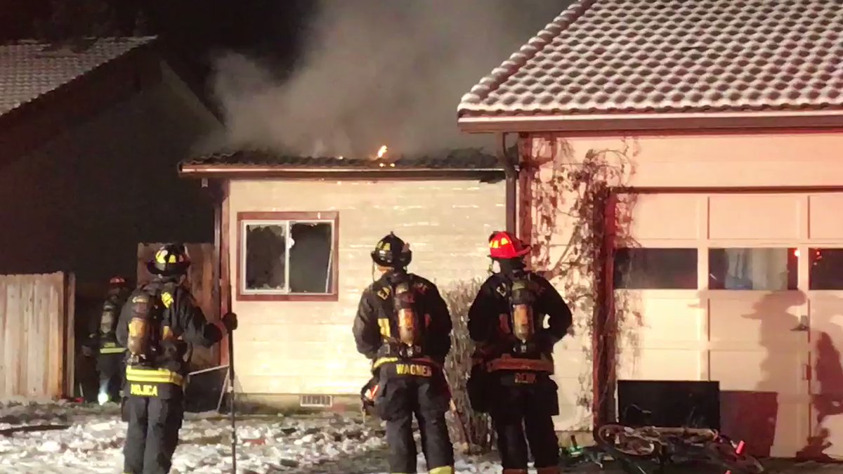 Firefighters in Boise are working to knockdown an early morning house fire. Flames and smoke can be seen coming out of the top of the home   